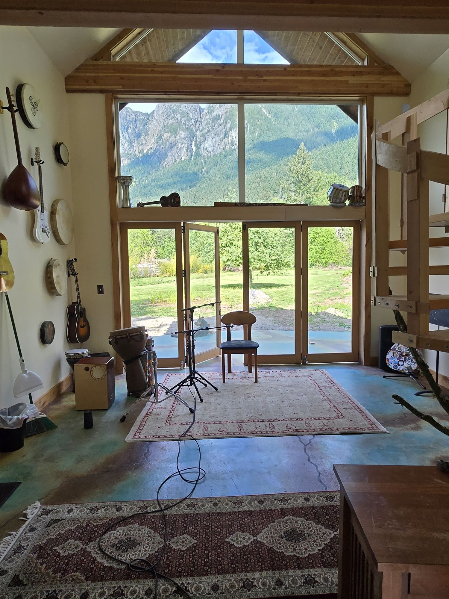 Alpenglow Studio live room with Mount Si framed through full-height windows